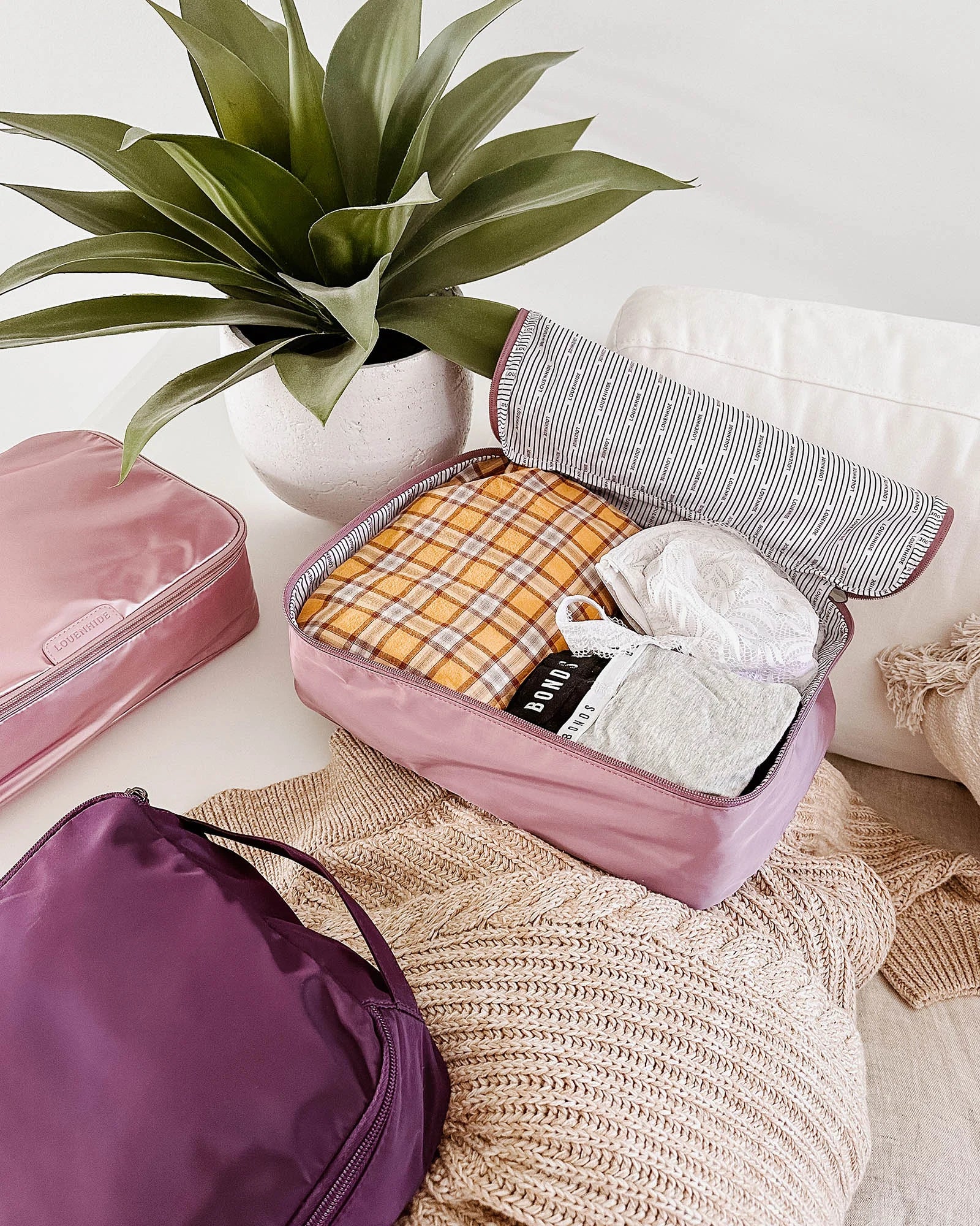 The Louenhide Madras 3 Piece Packing Cube Set will transform the way you travel. Maximize space and minimize bulk with the three varied sizes in three complementary hues. Use the smaller cube for your personal items, the medium for lighter pieces and the largest cube for your chunky knits and jeans.