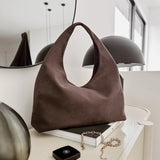 The Louenhide Monaco Shoulder Bag is the it-girl bag and our top seller. Whether it's a day at the office, a girls' lunch, or a casual outing, the Monaco is suited for any occasion. Her slouchy, minimalistic design adds a soft yet sleek element to the shoulder bags exterior while also allowing ample interior space to fit your everyday essentials and more. The seamless teardrop silhouette sits comfortably over the shoulder as you go about your day. Elevate your style and invest in the must-have Monaco Shoul