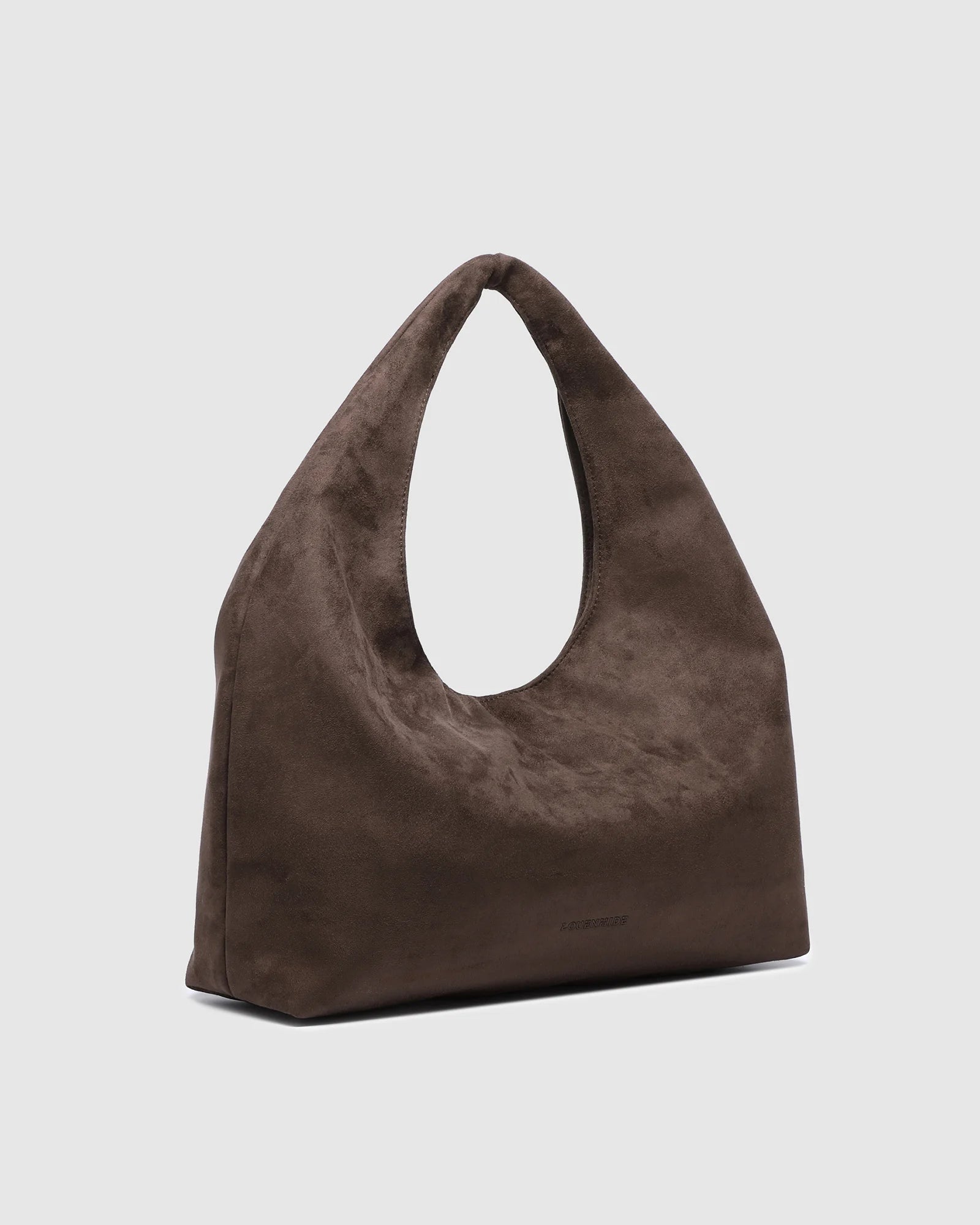 The Louenhide Monaco Shoulder Bag is the it-girl bag and our top seller. Whether it's a day at the office, a girls' lunch, or a casual outing, the Monaco is suited for any occasion. Her slouchy, minimalistic design adds a soft yet sleek element to the shoulder bags exterior while also allowing ample interior space to fit your everyday essentials and more. The seamless teardrop silhouette sits comfortably over the shoulder as you go about your day. Elevate your style and invest in the must-have Monaco Shoul