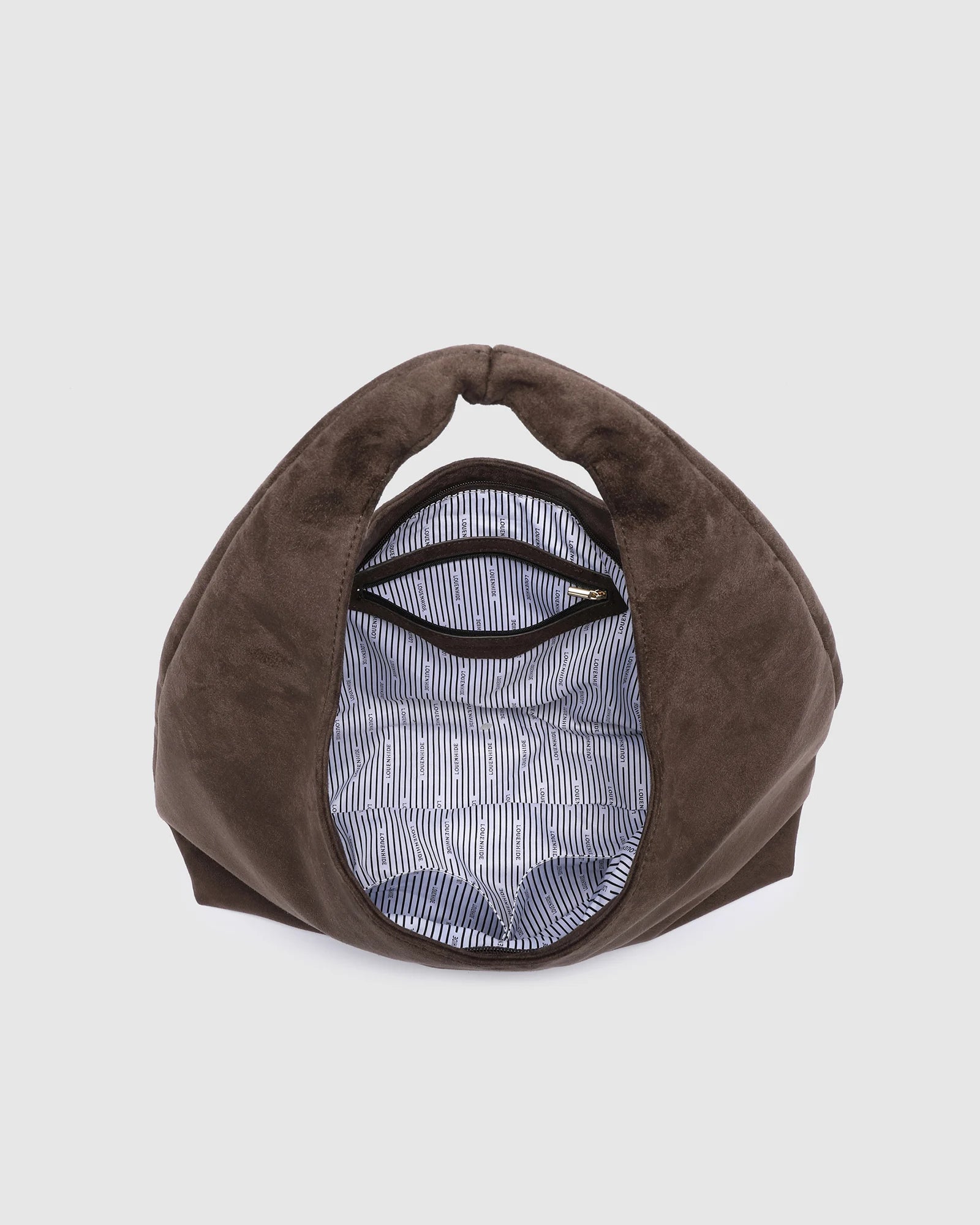 The Louenhide Monaco Shoulder Bag is the it-girl bag and our top seller. Whether it's a day at the office, a girls' lunch, or a casual outing, the Monaco is suited for any occasion. Her slouchy, minimalistic design adds a soft yet sleek element to the shoulder bags exterior while also allowing ample interior space to fit your everyday essentials and more. The seamless teardrop silhouette sits comfortably over the shoulder as you go about your day. Elevate your style and invest in the must-have Monaco Shoul