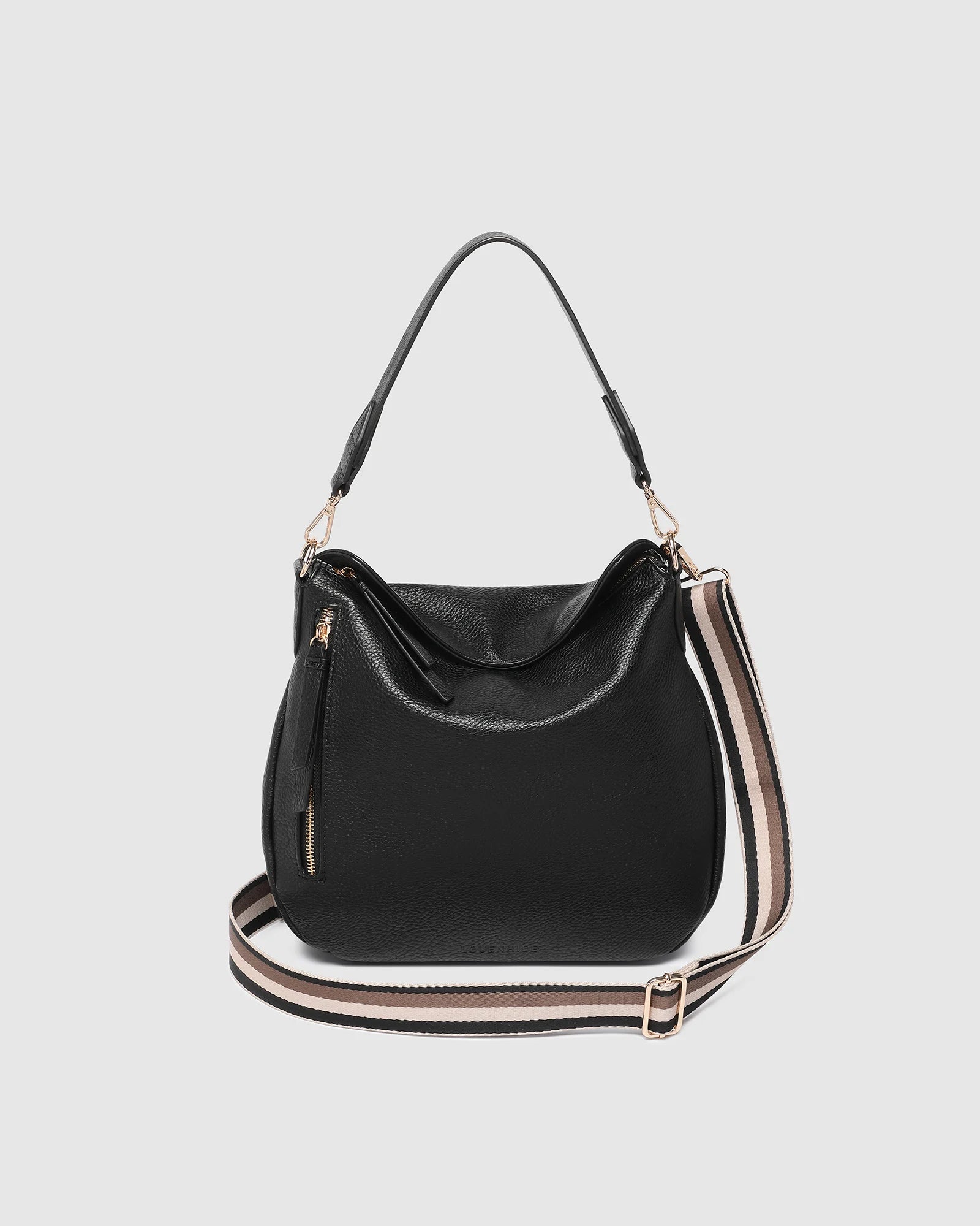 The Louenhide Nadia Shoulder Bag is your new go-to when your day calls for casual styling. Whether you’re running errands or heading off to lunch, the relaxed and slouchy silhouette allows you to fit all your essentials, while maintaining a compact and slender fit under your arm. With a bonus strap inside, completely customize your look from a comfortable shoulder bag to a practical crossbody. Make every day easy with this multi-wear everyday shoulder bag.