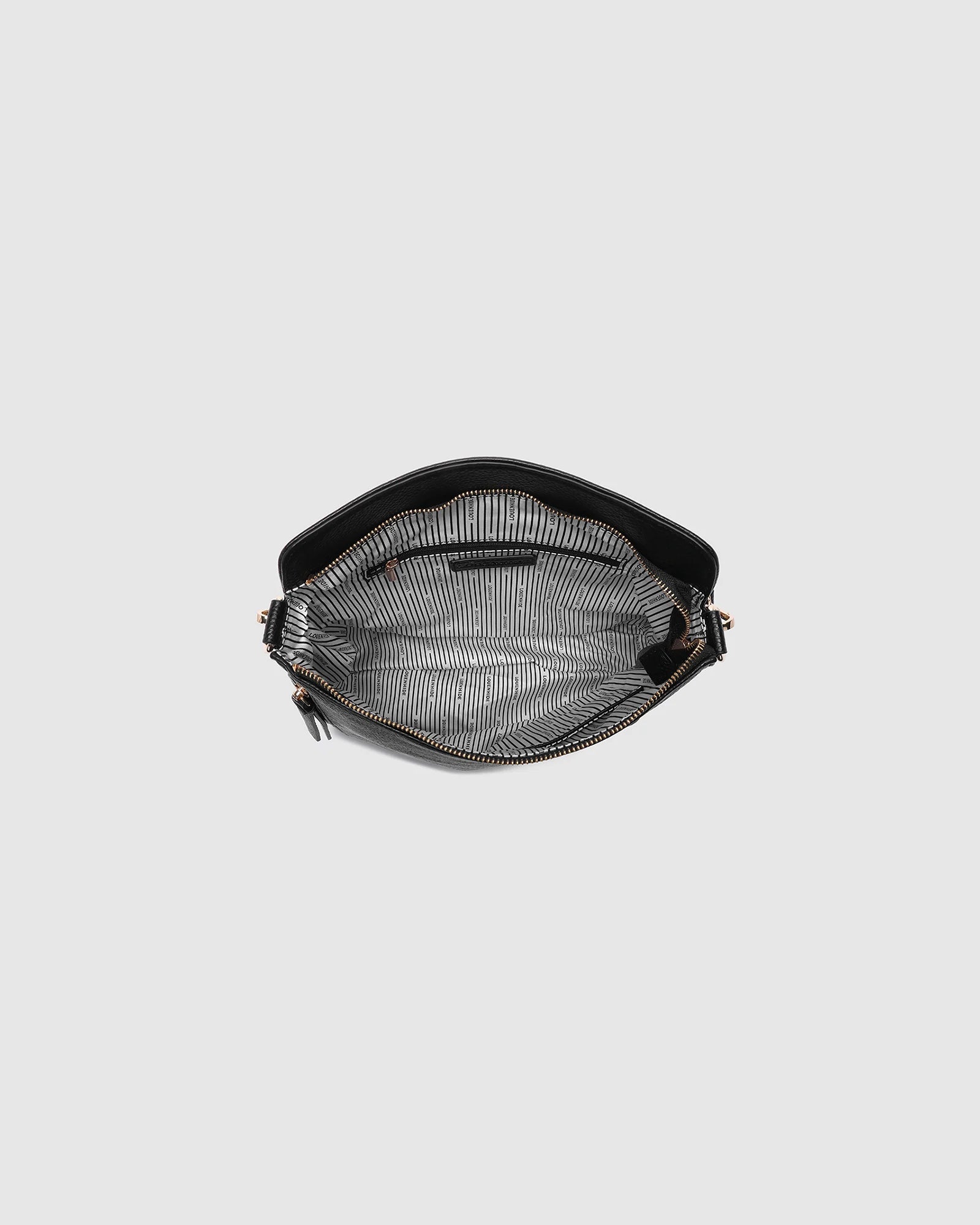 The Louenhide Nadia Shoulder Bag is your new go-to when your day calls for casual styling. Whether you’re running errands or heading off to lunch, the relaxed and slouchy silhouette allows you to fit all your essentials, while maintaining a compact and slender fit under your arm. With a bonus strap inside, completely customize your look from a comfortable shoulder bag to a practical crossbody. Make every day easy with this multi-wear everyday shoulder bag.