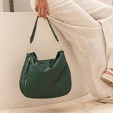 The Louenhide Nadia Shoulder Bag is your new go-to when your day calls for casual styling. Whether you’re running errands or heading off to lunch, the relaxed and slouchy silhouette allows you to fit all your essentials, while maintaining a compact and slender fit under your arm. With a bonus strap inside, completely customize your look from a comfortable shoulder bag to a practical crossbody. Make every day easy with this multi-wear everyday shoulder bag.