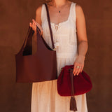 The Louenhide Paisley Handbag is unapologetically bold, textural, and designed to elevate your look with zero effort. Throw it over your arm or wear the internal faux shearling bucket bag for a more relaxed finish - either way, the Paisley is here to play. Worn together or styled separately, the pairing creates an unexpected contrast that brings warmth and softness to structured winter layering. Whether you're styling it back with leather, denim or sweeping silhouettes, the Paisley Handbag easily earns its