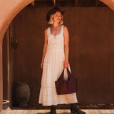 The Louenhide Paisley Handbag is unapologetically bold, textural, and designed to elevate your look with zero effort. Throw it over your arm or wear the internal faux shearling bucket bag for a more relaxed finish - either way, the Paisley is here to play. Worn together or styled separately, the pairing creates an unexpected contrast that brings warmth and softness to structured winter layering. Whether you're styling it back with leather, denim or sweeping silhouettes, the Paisley Handbag easily earns its