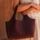 The Louenhide Paisley Handbag is unapologetically bold, textural, and designed to elevate your look with zero effort. Throw it over your arm or wear the internal faux shearling bucket bag for a more relaxed finish - either way, the Paisley is here to play. Worn together or styled separately, the pairing creates an unexpected contrast that brings warmth and softness to structured winter layering. Whether you're styling it back with leather, denim or sweeping silhouettes, the Paisley Handbag easily earns its