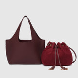 The Louenhide Paisley Handbag is unapologetically bold, textural, and designed to elevate your look with zero effort. Throw it over your arm or wear the internal faux shearling bucket bag for a more relaxed finish - either way, the Paisley is here to play. Worn together or styled separately, the pairing creates an unexpected contrast that brings warmth and softness to structured winter layering. Whether you're styling it back with leather, denim or sweeping silhouettes, the Paisley Handbag easily earns its
