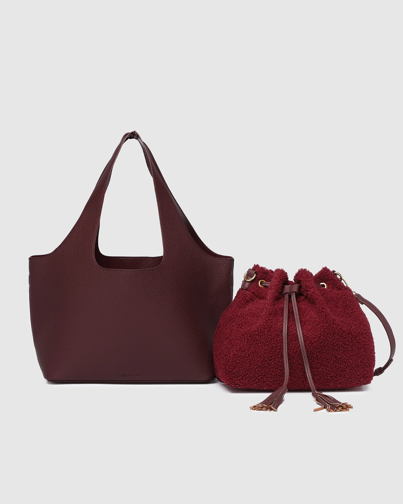 The Louenhide Paisley Handbag is unapologetically bold, textural, and designed to elevate your look with zero effort. Throw it over your arm or wear the internal faux shearling bucket bag for a more relaxed finish - either way, the Paisley is here to play. Worn together or styled separately, the pairing creates an unexpected contrast that brings warmth and softness to structured winter layering. Whether you're styling it back with leather, denim or sweeping silhouettes, the Paisley Handbag easily earns its