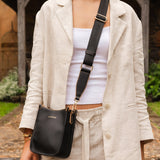The Louenhide Parker Phone Crossbody Bag effortlessly combines an elevated aesthetic with everyday functionality. Whether you're heading to the office, running errands or meeting friends for coffee, this minimalistic phone bag will be your new go-to. Parker features an on-trend and modern silhouette, enhanced by the contrasting stitch details in two classic colourways. Elevate your style with the sateen webbing guitar strap or keep it simple with the matching vegan leather crossbody strap. Keeping your esse