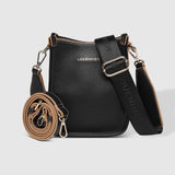 The Louenhide Parker Phone Crossbody Bag effortlessly combines an elevated aesthetic with everyday functionality. Whether you're heading to the office, running errands or meeting friends for coffee, this minimalistic phone bag will be your new go-to. Parker features an on-trend and modern silhouette, enhanced by the contrasting stitch details in two classic colourways. Elevate your style with the sateen webbing guitar strap or keep it simple with the matching vegan leather crossbody strap. Keeping your esse
