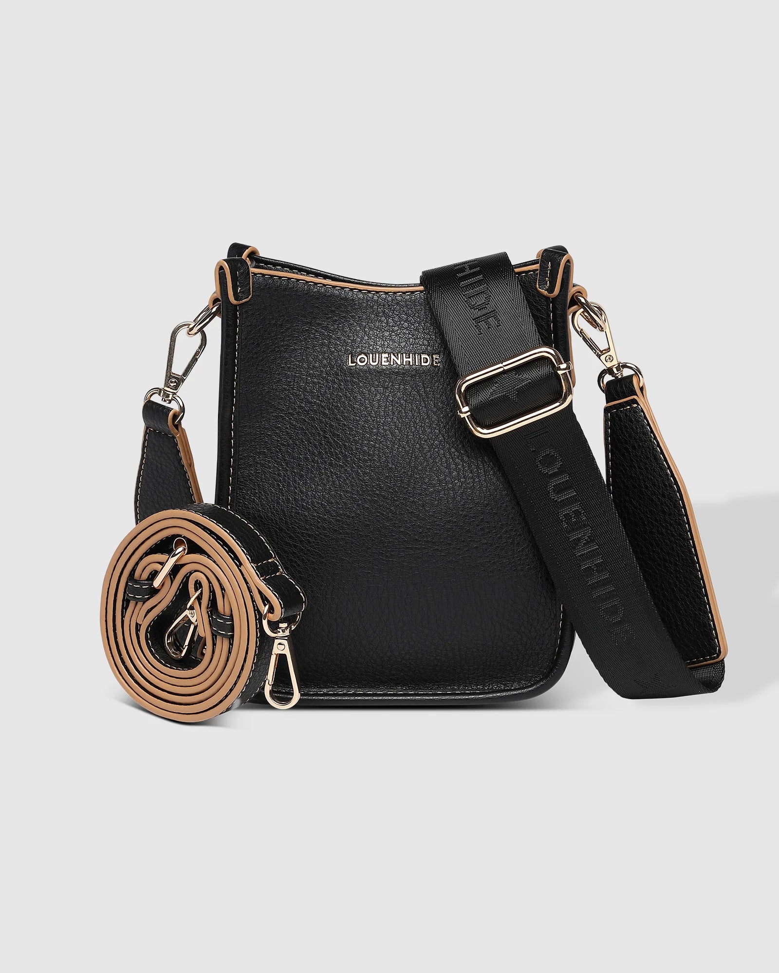 The Louenhide Parker Phone Crossbody Bag effortlessly combines an elevated aesthetic with everyday functionality. Whether you're heading to the office, running errands or meeting friends for coffee, this minimalistic phone bag will be your new go-to. Parker features an on-trend and modern silhouette, enhanced by the contrasting stitch details in two classic colourways. Elevate your style with the sateen webbing guitar strap or keep it simple with the matching vegan leather crossbody strap. Keeping your esse