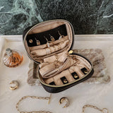 The Louenhide Rita Jewelry Case is the ideal travel accessory you didn't know you needed. Perfectly sized for travel, this women's jewellery case is a must-have for keeping your jewellery organized and protected on the go. Its sleek design fits effortlessly into your luggage or carry-on, while ensuring your accessories are always secure, organised and ready to shine. Say goodbye to tangled necklaces and lost earrings. With the ultimate internal organisation, there's a spot for everything. Whether you're jet