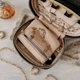 The Louenhide Rita Jewelry Case is the ideal travel accessory you didn't know you needed. Perfectly sized for travel, this women's jewellery case is a must-have for keeping your jewellery organized and protected on the go. Its sleek design fits effortlessly into your luggage or carry-on, while ensuring your accessories are always secure, organised and ready to shine. Say goodbye to tangled necklaces and lost earrings. With the ultimate internal organisation, there's a spot for everything. Whether you're jet