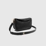 The Louenhide Saylor Crossbody Bag brings a bold yet refined edge to your everyday styling in a soft vegan leather finish. A sleek baguette-shaped silhouette, this cross body bag with chain detailing blends texture and refinement in all the right ways. Designed to be worn with ease but styled to stand out, the Saylor Black moves effortlessly from day to night, adding impact to your layered winter looks. Wherever the day leads, this chain strap handbag is the finishing touch that completes the look.