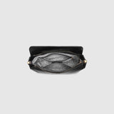 The Louenhide Saylor Crossbody Bag brings a bold yet refined edge to your everyday styling in a soft vegan leather finish. A sleek baguette-shaped silhouette, this cross body bag with chain detailing blends texture and refinement in all the right ways. Designed to be worn with ease but styled to stand out, the Saylor Black moves effortlessly from day to night, adding impact to your layered winter looks. Wherever the day leads, this chain strap handbag is the finishing touch that completes the look.