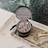 The Louenhide Sofia Jewelry Box is designed to hold and protect your most treasured pieces. Featuring a compact silhouette with two protective compartments, this multi-zipper case offers a streamlined way to store your jewellery without taking up unnecessary space. This travel jewellery case is the perfect addition to your bag, ensuring valuables stay secure and organised wherever the day leads.