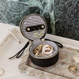 The Louenhide Sofia Jewelry Box is designed to hold and protect your most treasured pieces. Featuring a compact silhouette with two protective compartments, this multi-zipper case offers a streamlined way to store your jewellery without taking up unnecessary space. This travel jewellery case is the perfect addition to your bag, ensuring valuables stay secure and organised wherever the day leads.