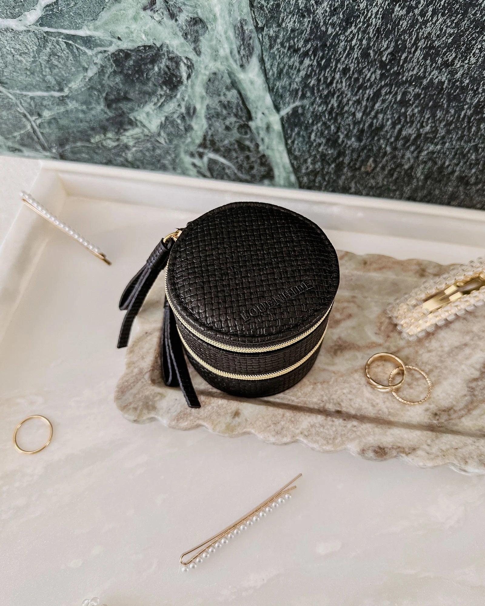 The Louenhide Sofia Jewelry Box is designed to hold and protect your most treasured pieces. Featuring a compact silhouette with two protective compartments, this multi-zipper case offers a streamlined way to store your jewellery without taking up unnecessary space. This travel jewellery case is the perfect addition to your bag, ensuring valuables stay secure and organised wherever the day leads.
