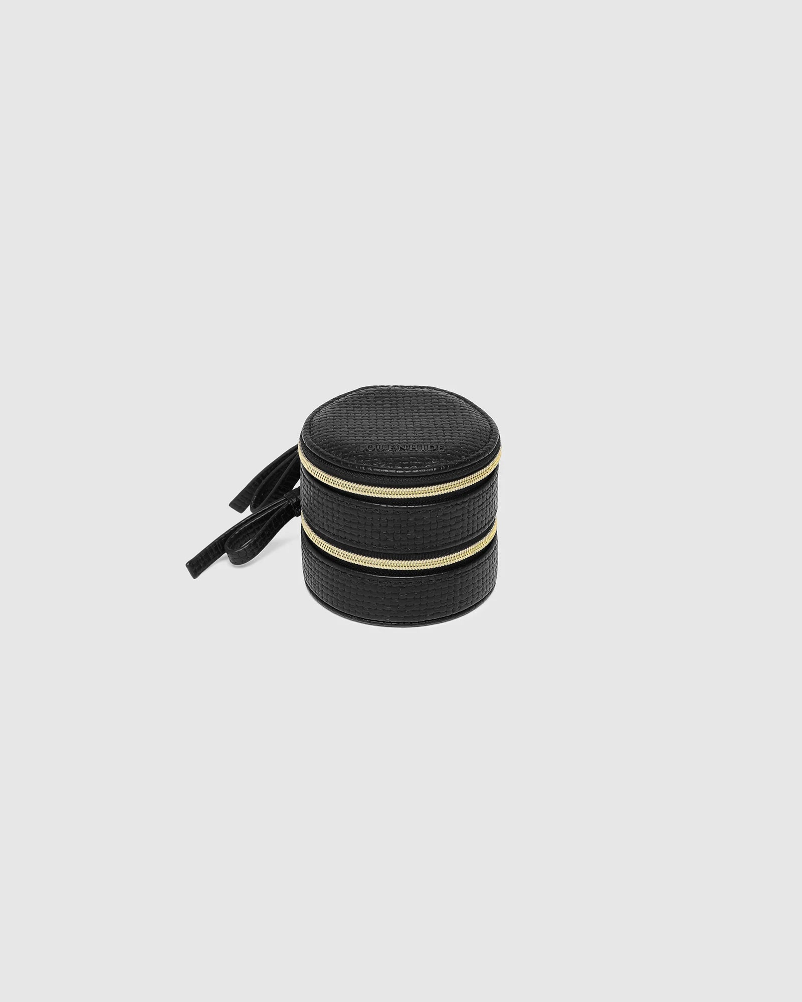 The Louenhide Sofia Jewelry Box is designed to hold and protect your most treasured pieces. Featuring a compact silhouette with two protective compartments, this multi-zipper case offers a streamlined way to store your jewellery without taking up unnecessary space. This travel jewellery case is the perfect addition to your bag, ensuring valuables stay secure and organised wherever the day leads.