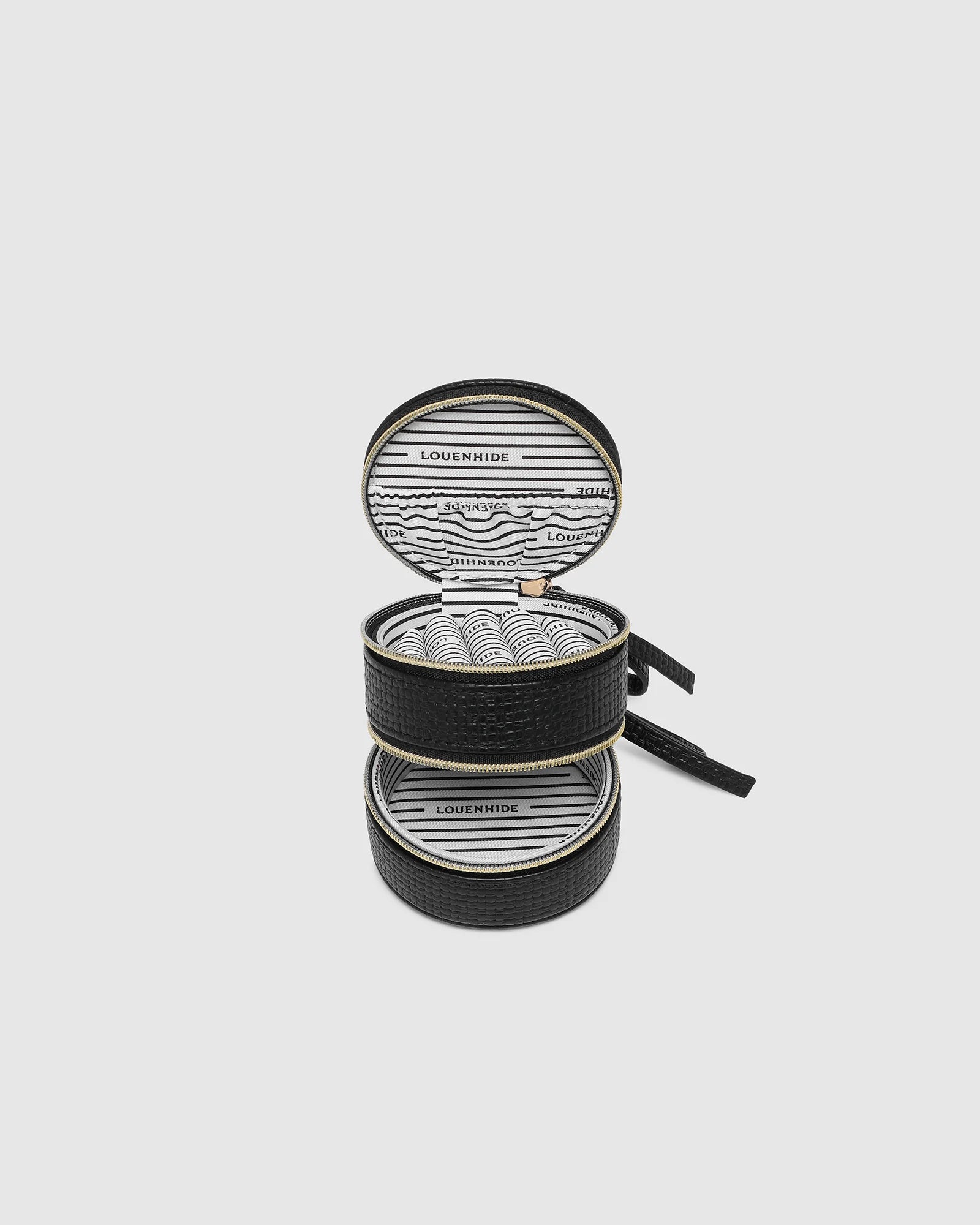 The Louenhide Sofia Jewelry Box is designed to hold and protect your most treasured pieces. Featuring a compact silhouette with two protective compartments, this multi-zipper case offers a streamlined way to store your jewellery without taking up unnecessary space. This travel jewellery case is the perfect addition to your bag, ensuring valuables stay secure and organised wherever the day leads.