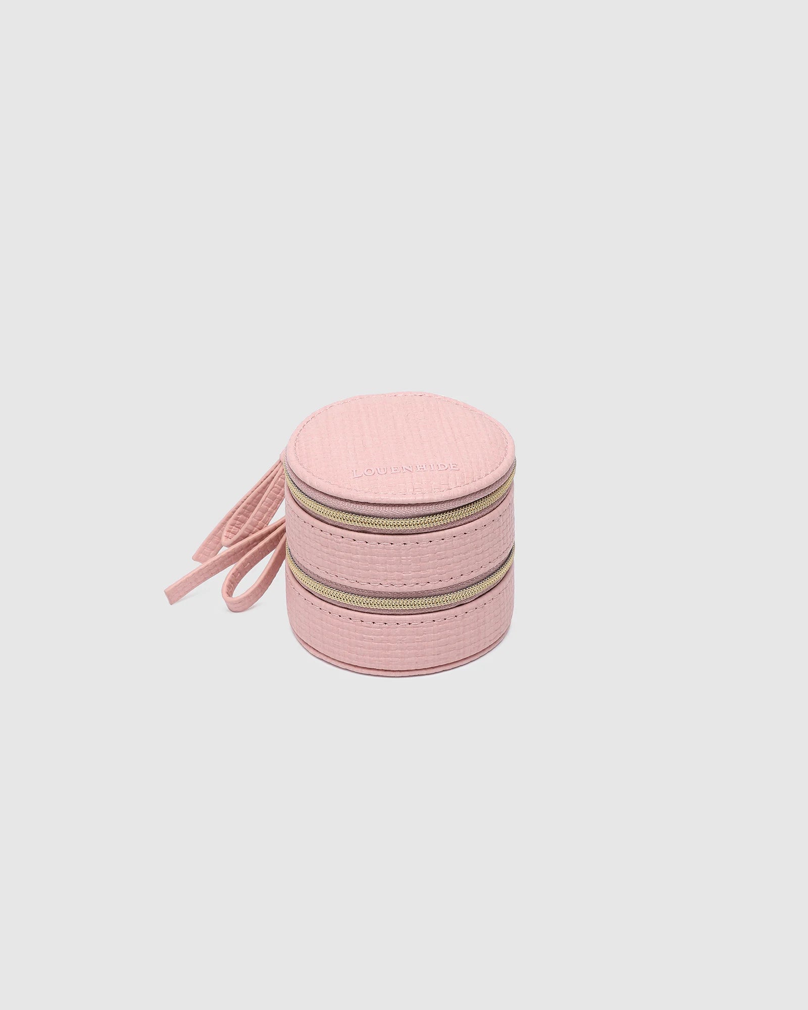 The Louenhide Sofia Jewelry Box is designed to hold and protect your most treasured pieces. Featuring a compact silhouette with two protective compartments, this multi-zipper case offers a streamlined way to store your jewellery without taking up unnecessary space. This travel jewellery case is the perfect addition to your bag, ensuring valuables stay secure and organised wherever the day leads.