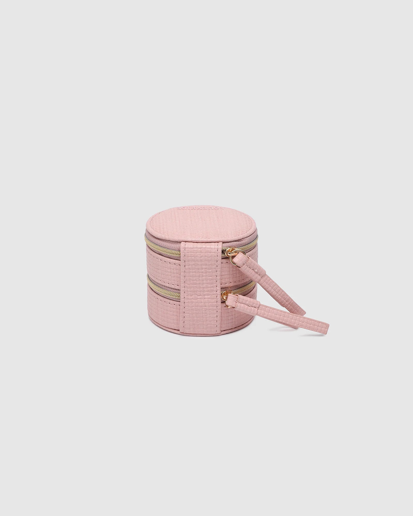 The Louenhide Sofia Jewelry Box is designed to hold and protect your most treasured pieces. Featuring a compact silhouette with two protective compartments, this multi-zipper case offers a streamlined way to store your jewellery without taking up unnecessary space. This travel jewellery case is the perfect addition to your bag, ensuring valuables stay secure and organised wherever the day leads.