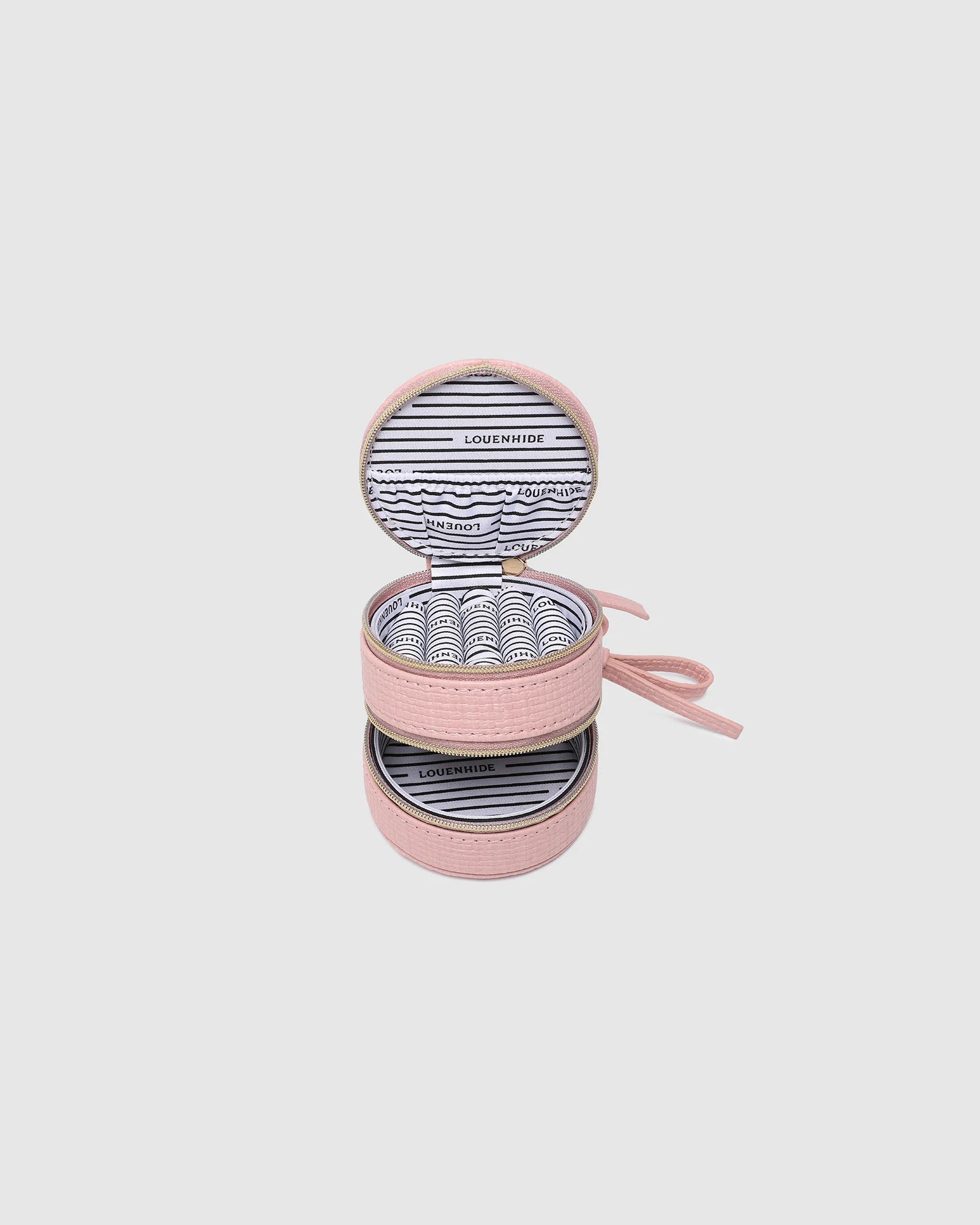The Louenhide Sofia Jewelry Box is designed to hold and protect your most treasured pieces. Featuring a compact silhouette with two protective compartments, this multi-zipper case offers a streamlined way to store your jewellery without taking up unnecessary space. This travel jewellery case is the perfect addition to your bag, ensuring valuables stay secure and organised wherever the day leads.