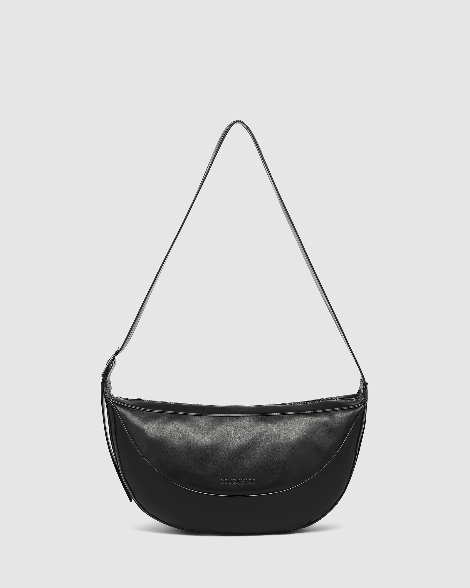 The Louenhide Stevie Crossbody Bag is your ultimate travel accessory. This on-trend crossbody bag is your go-to solution for keeping your essentials on hand while you explore new destinations or navigate your favourite city spots. From passports and travel documents to snacks, a water bottle, and even a small umbrella, this elevated everyday bag ensures you're prepared for any occasion. Look stylish and ensure comfort by adjusting the crossbody strap to your perfect position.