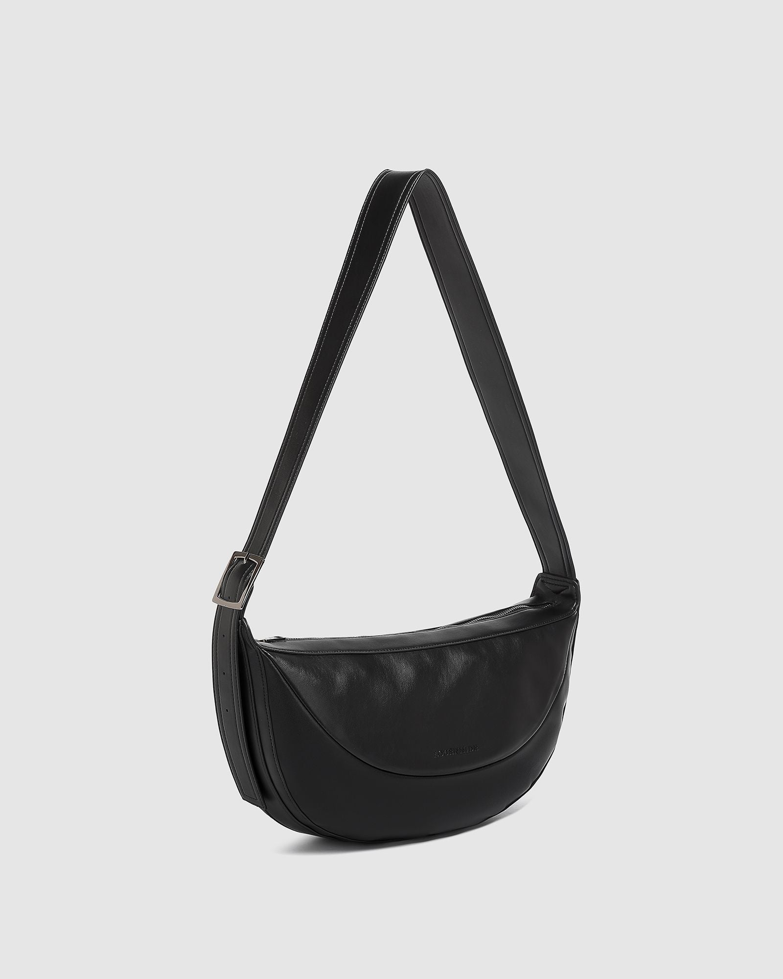 The Louenhide Stevie Crossbody Bag is your ultimate travel accessory. This on-trend crossbody bag is your go-to solution for keeping your essentials on hand while you explore new destinations or navigate your favourite city spots. From passports and travel documents to snacks, a water bottle, and even a small umbrella, this elevated everyday bag ensures you're prepared for any occasion. Look stylish and ensure comfort by adjusting the crossbody strap to your perfect position.