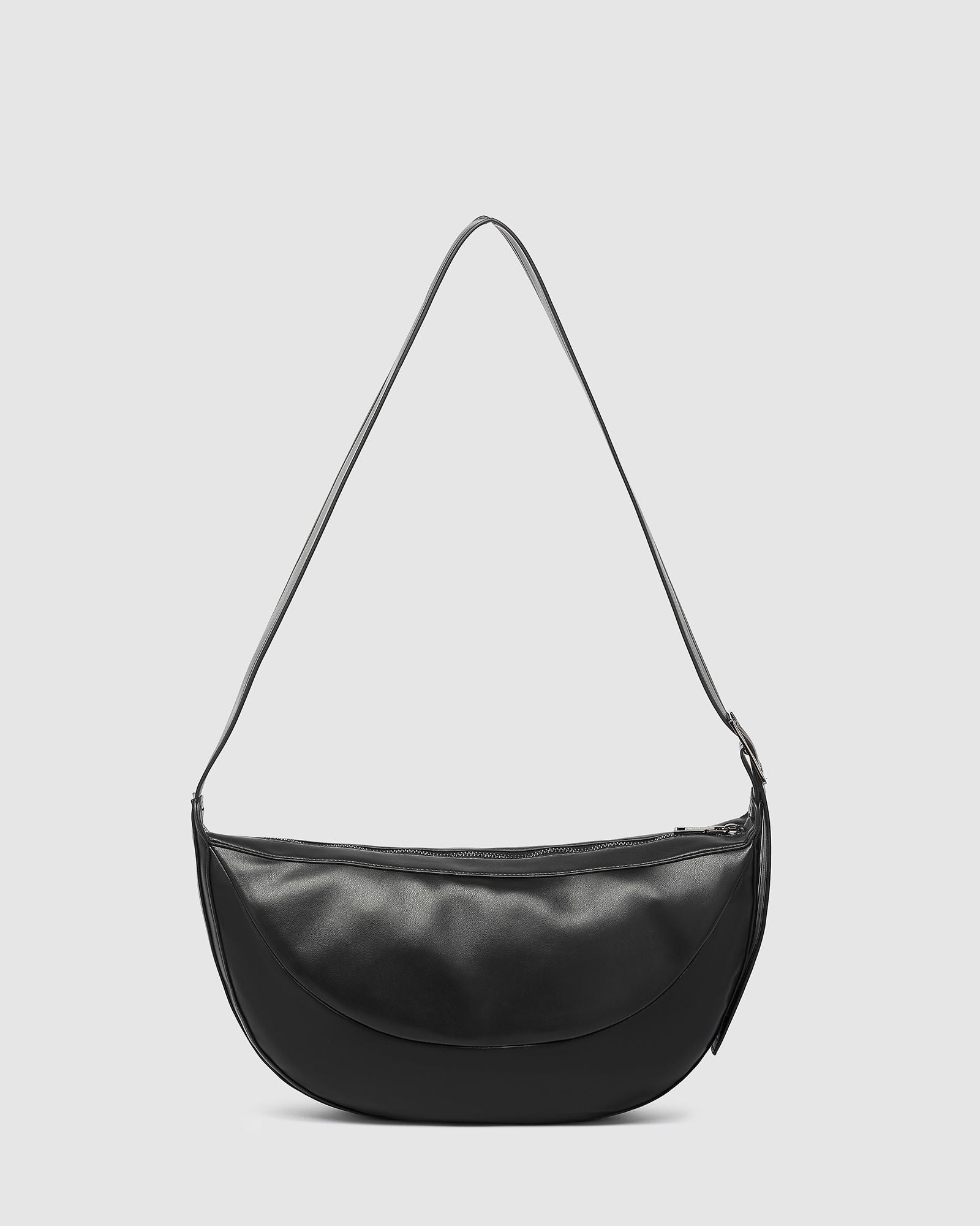 The Louenhide Stevie Crossbody Bag is your ultimate travel accessory. This on-trend crossbody bag is your go-to solution for keeping your essentials on hand while you explore new destinations or navigate your favourite city spots. From passports and travel documents to snacks, a water bottle, and even a small umbrella, this elevated everyday bag ensures you're prepared for any occasion. Look stylish and ensure comfort by adjusting the crossbody strap to your perfect position.