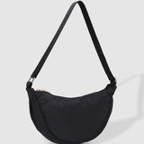The Louenhide Sylvia Nylon Crossbody Bag is an on-trend style, featuring a modern crescent silhouette.