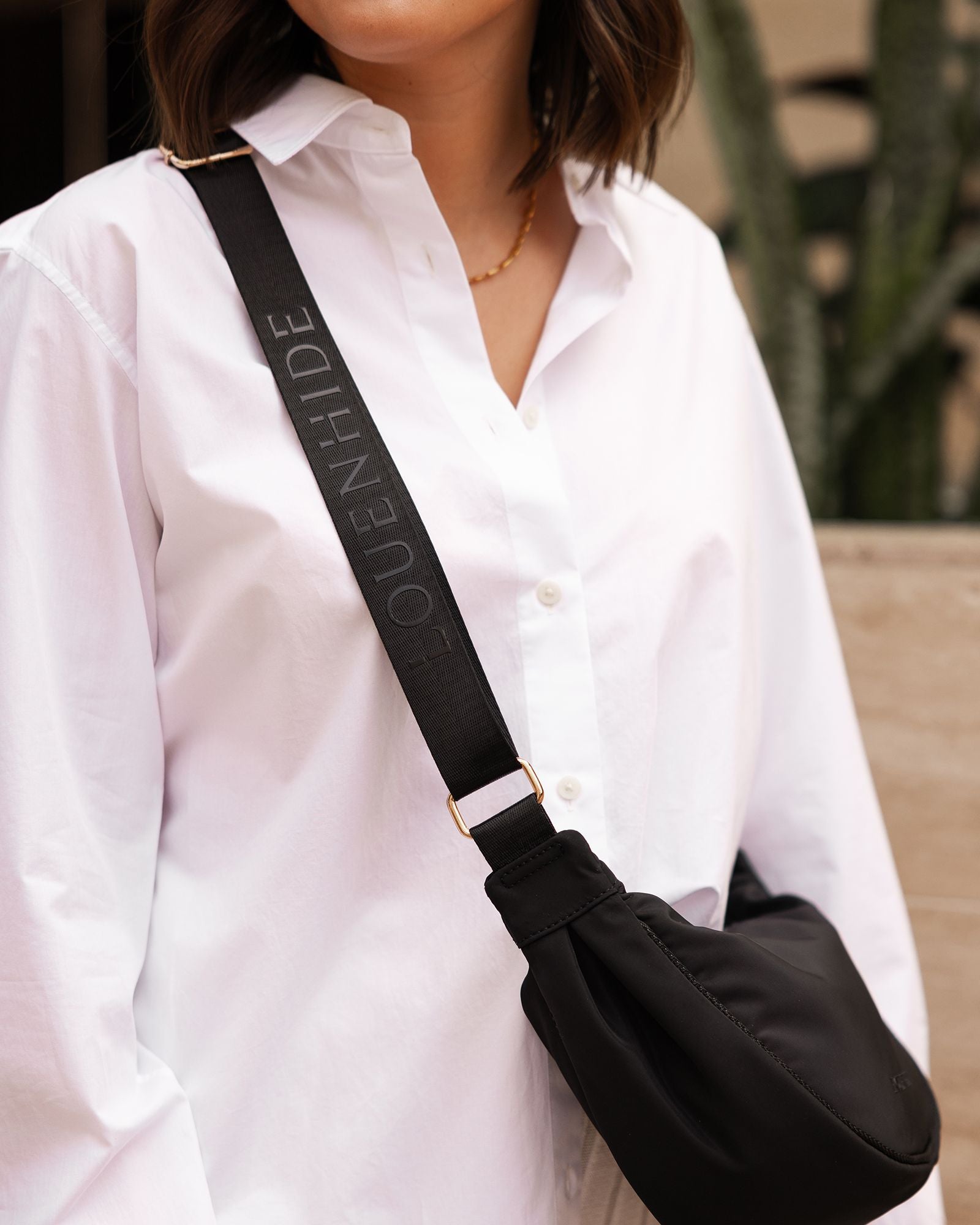 The Louenhide Sylvia Nylon Crossbody Bag is an on-trend style, featuring a modern crescent silhouette.