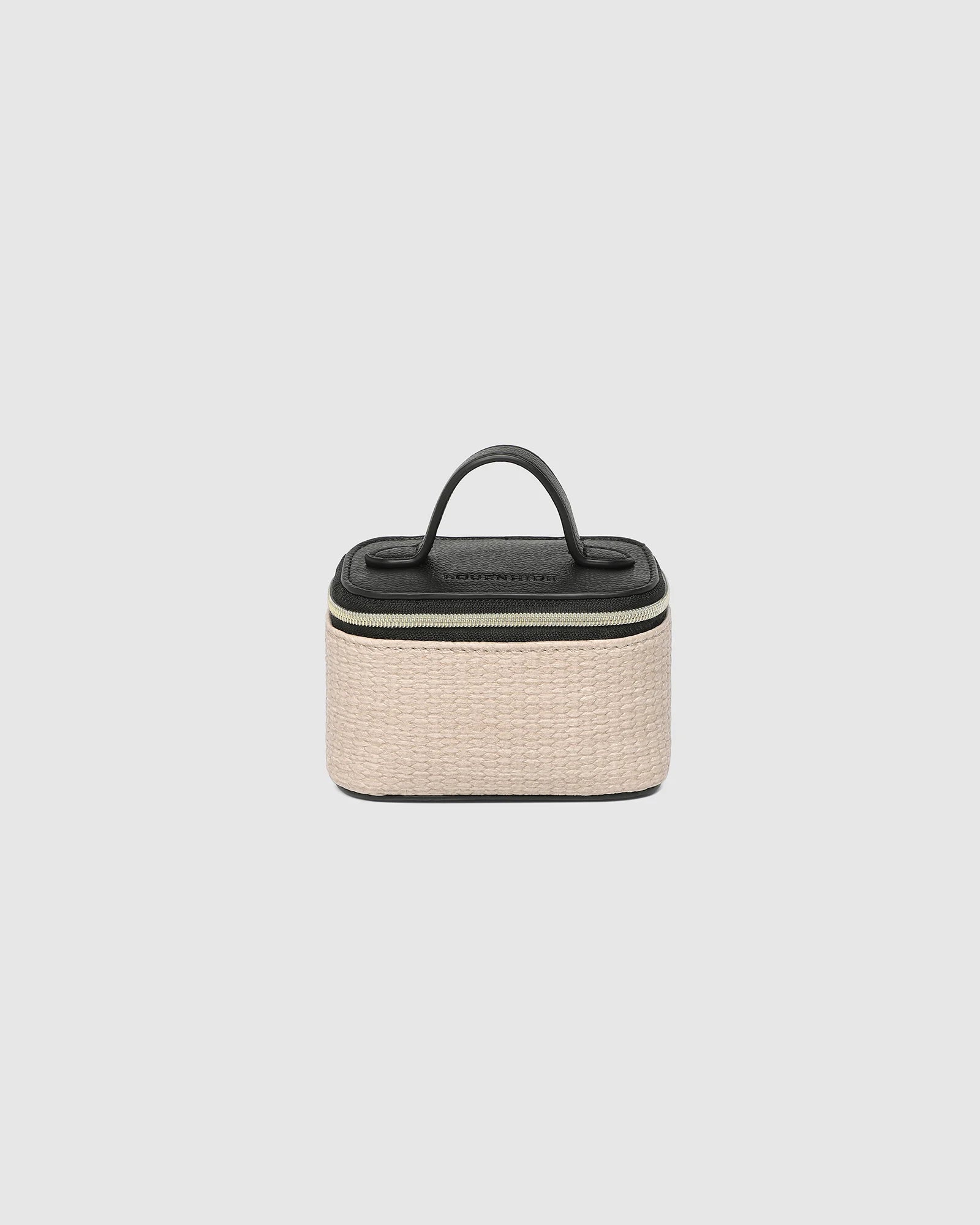 The Louenhide Trudy Jewelry Box is the perfect solution to keeping your valuables safely organized on the go. This compact travel jewelry case fits seamlessly into your luggage without taking up space. The secure zip closure ensures your jewelry stays protected, while the textured raffia and contrasting faux leather exterior add a touch of understated luxury to your travel style.