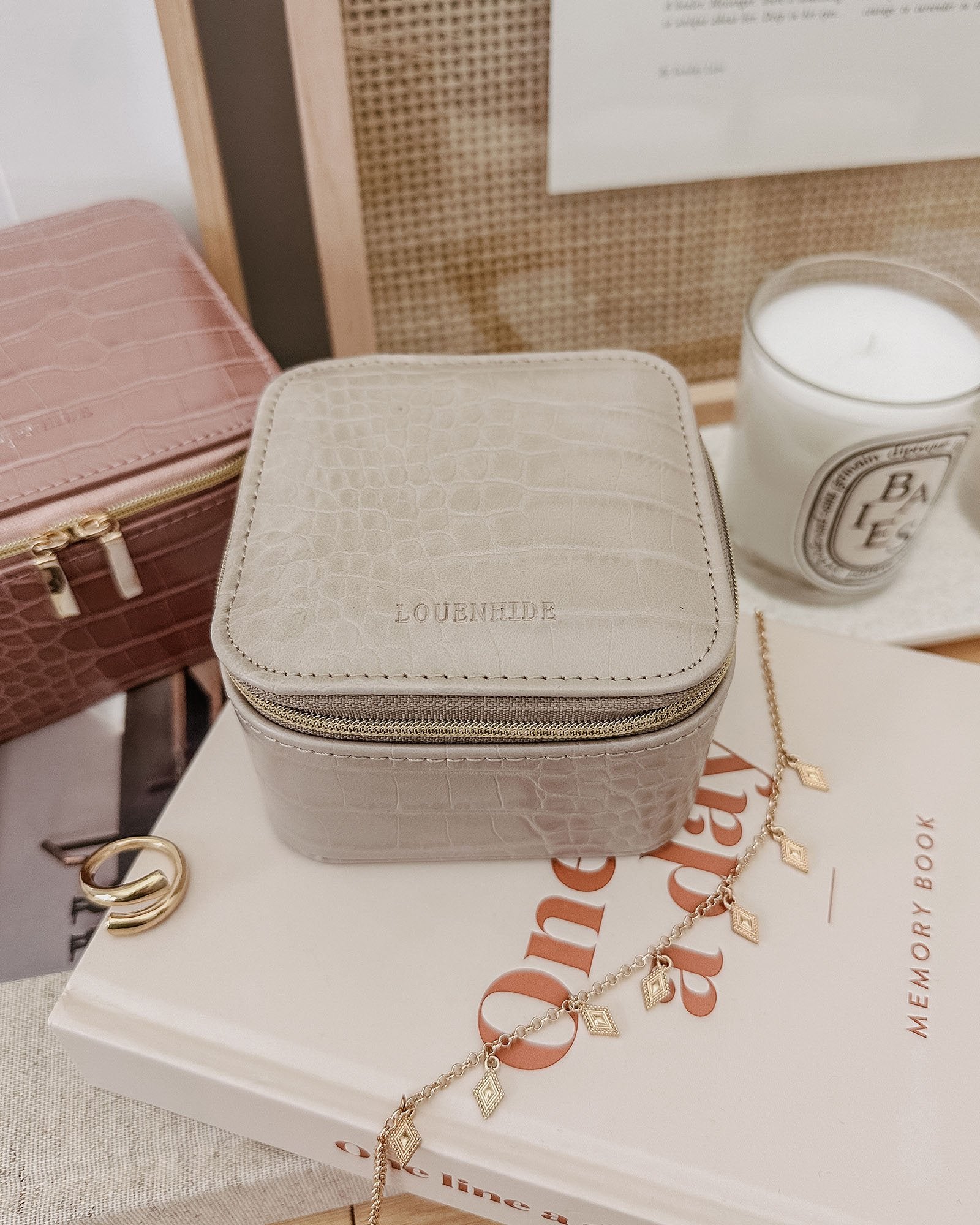 The Louenhide Beau Jewelry Box is a small, square jewellery organizer designed to keep your pieces safe and secure at home or when you are on the go. Featuring a vegan croc exterior, the Beau is every woman's dream jewelry case! Store your larger pieces in the main compartment, while safely stowing your smaller jewels in the elasticated slip pocket