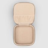 The Louenhide Beau Jewelry Box is a small, square jewellery organizer designed to keep your pieces safe and secure at home or when you are on the go. Featuring a vegan croc exterior, the Beau is every woman's dream jewelry case! Store your larger pieces in the main compartment, while safely stowing your smaller jewels in the elasticated slip pocket