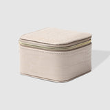 The Louenhide Beau Jewelry Box is a small, square jewellery organizer designed to keep your pieces safe and secure at home or when you are on the go. Featuring a vegan croc exterior, the Beau is every woman's dream jewelry case! Store your larger pieces in the main compartment, while safely stowing your smaller jewels in the elasticated slip pocket