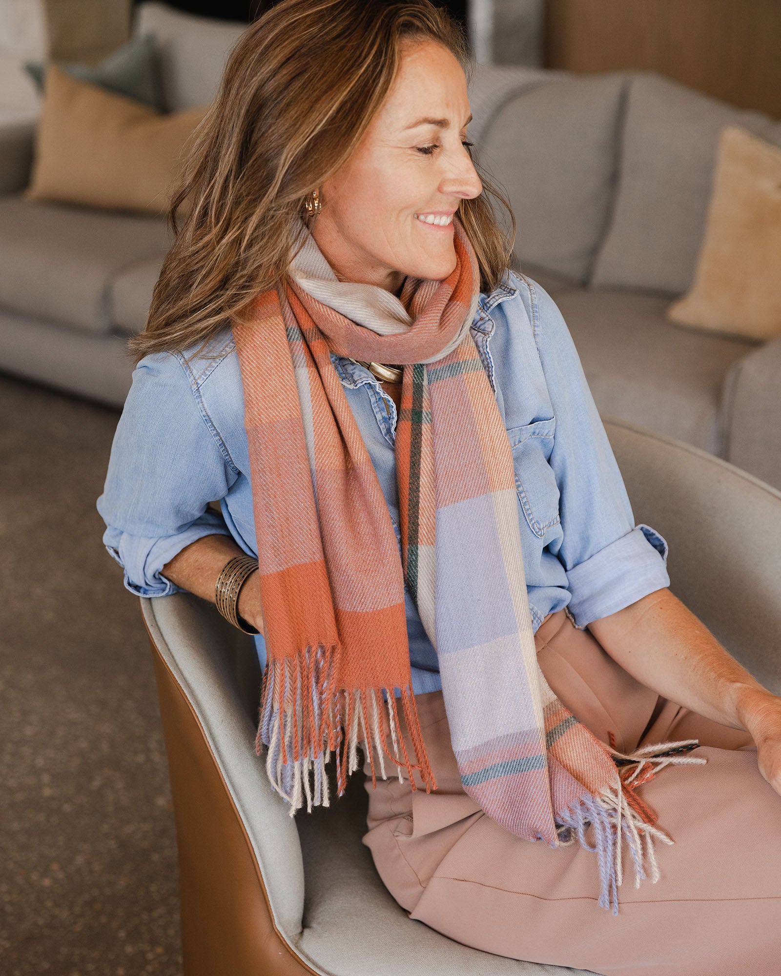 The Louenhide Balmoral Scarf features a cosy plaid pattern that adds a hint of colour to any wintery look.
