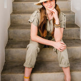 This hat combines effortless style with a laid-back vibe, thanks to its natural fiber weave and subtly frayed brim. Ideal for outdoor festivals, beach parties, or evenings at a tiki bar, it’s the ultimate accessory for sun-soaked adventures. The black ribbon and braided raffia trim add a sophisticated yet casual touch, making it a versatile piece that stands out wherever you go.
