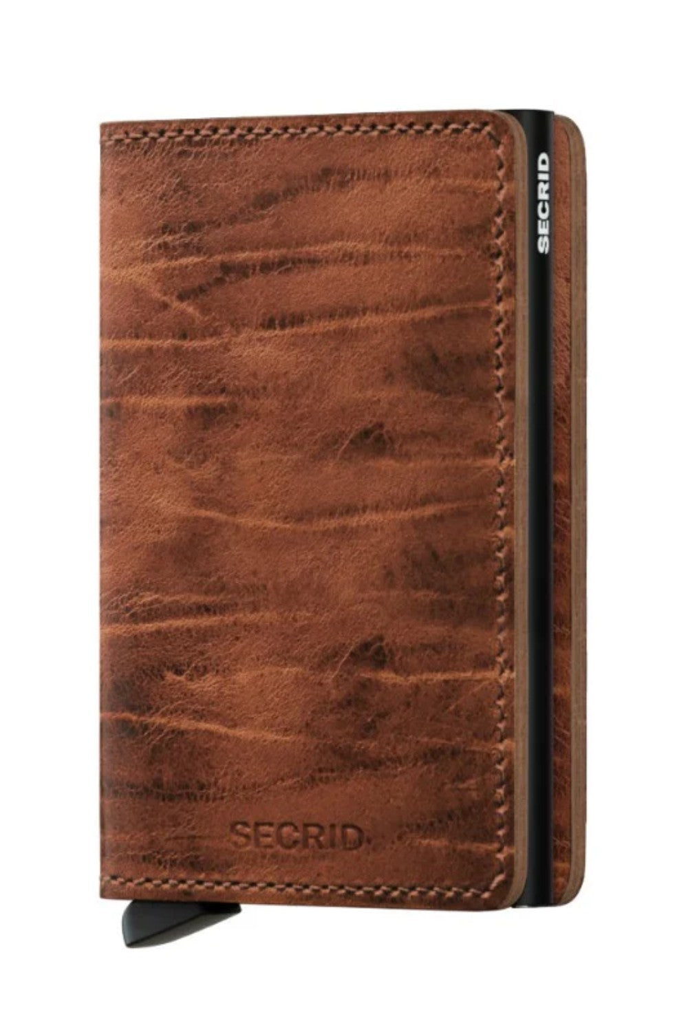 The Slimwallet is a modern take on the classic billfold. With its slim profile, it fits perfectly into every pocket. The generously cut leather holds at least an additional six cards, banknotes and business cards.The patented mechanism allows you to slide out your cards with one simple motion, ready for immediate use. The aluminium protects from bending, breaking and unwanted wireless communication.