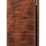 The Slimwallet is a modern take on the classic billfold. With its slim profile, it fits perfectly into every pocket. The generously cut leather holds at least an additional six cards, banknotes and business cards.The patented mechanism allows you to slide out your cards with one simple motion, ready for immediate use. The aluminium protects from bending, breaking and unwanted wireless communication.