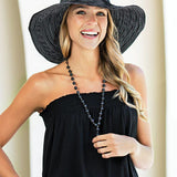 Charming white polka dots cover the classic black Scrunchie hat for a timeless look. The wire-edged brim hat can be adjusted for every mood – straighten it out for a stylish silhouette or wear it wavy for a flirty look. The wide brim allows for maximum sun protection.