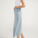 Staple denim skirt for spring and beyond. Our light-medium wash midi skirt is the perfect statement piece, dressed up or down. With a flattering front slit and vintage-inspired details, this is a skirt you'll love wearing everywhere.