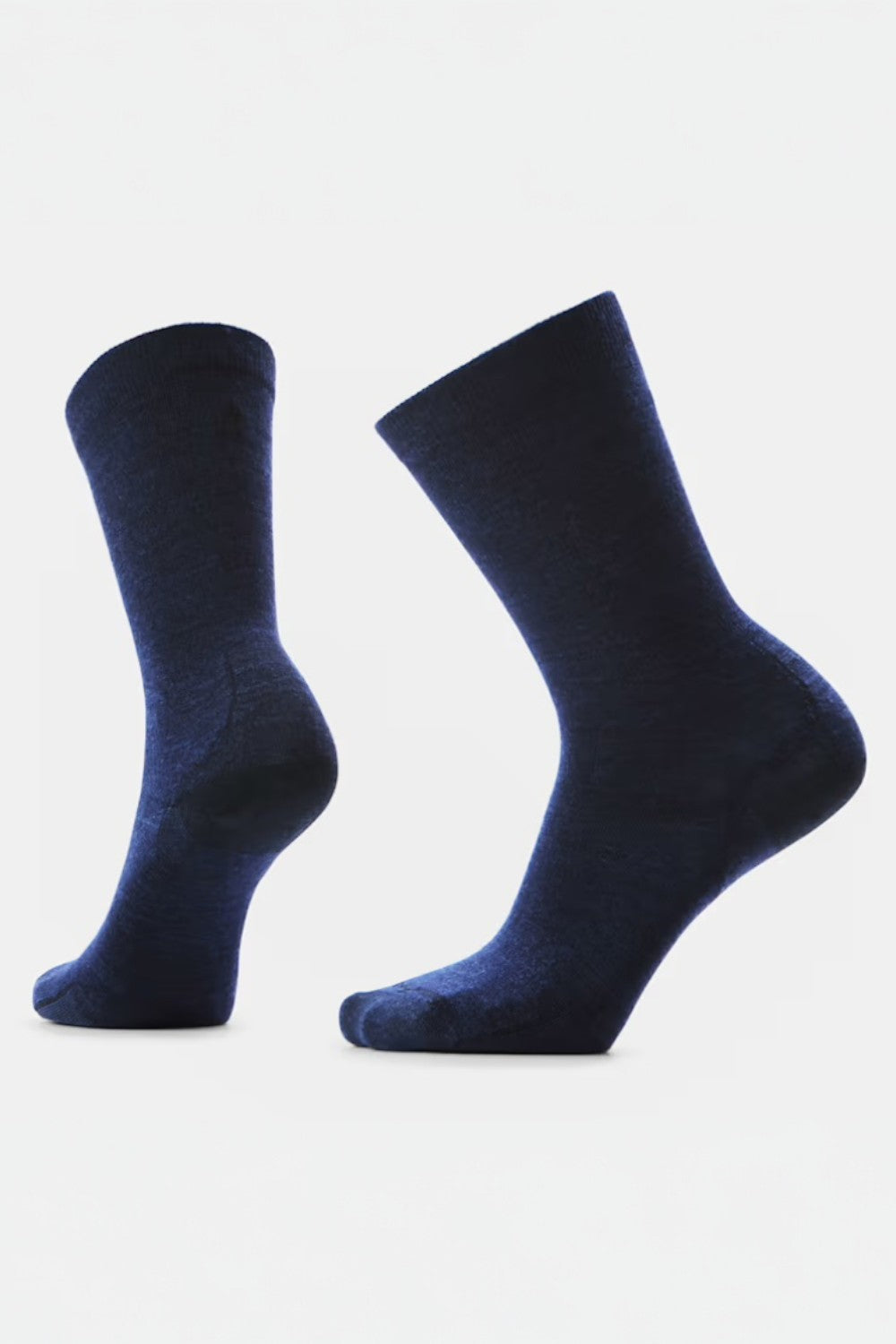 Pair of dark blue socks on a light gray background