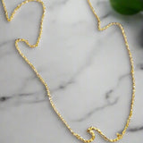 Ride the wave with this Chainlink Necklace featuring a handmade wave pendant. Gold plated for a delicate touch, this necklace is perfect for any occasion.