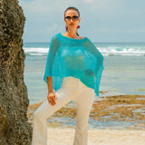 Crafted from lightweight sheer fabric, our Sheer Mesh Poncho is the perfect accessory to cover your shoulders in style. Its versatile design can be dressed up or down, making it a must-have for any wardrobe. Stay cool and chic all at once with this fashionable poncho.