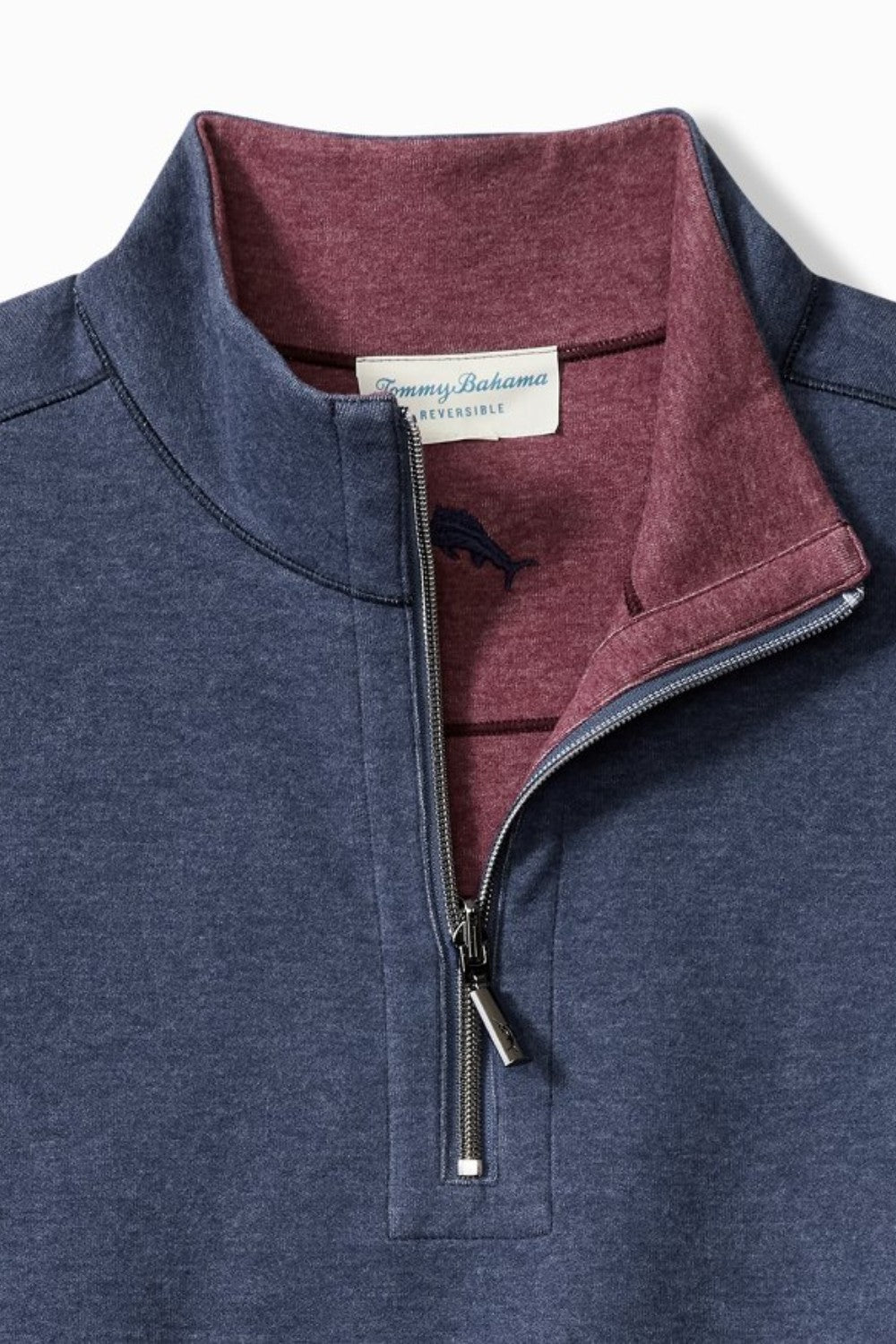 Blue pullover with maroon interior collar and Tommy Bahama label.