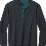 Dark gray pullover with green collar on a white background