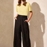 Crafted from a breathable linen-blend weave and designed with a stylish hem vent detail, these wide-leg ankle pants are a go-to favourite for warm weather. An elastic back waistband provides a comfortable fit, while handy front pockets offer convenient storage for your daily necessities.