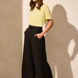 Crafted from a breathable linen-blend weave and designed with a stylish hem vent detail, these wide-leg ankle pants are a go-to favourite for warm weather. An elastic back waistband provides a comfortable fit, while handy front pockets offer convenient storage for your daily necessities.