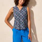 Elevate your style with this polo top featuring an eye-catching textured print. The sleeveless design keeps you cool on warmer days, while the shirttail finish offers a draped look that makes it easy to tuck in.